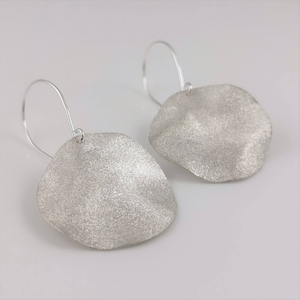 1. Undulating Silver Disc Drop Earrings