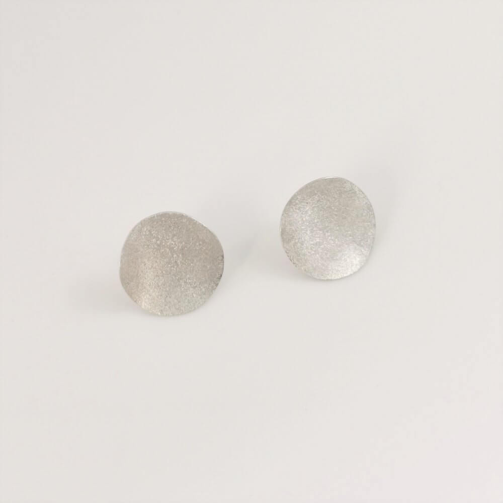 1. Undulating Silver Disc Stud Earrings